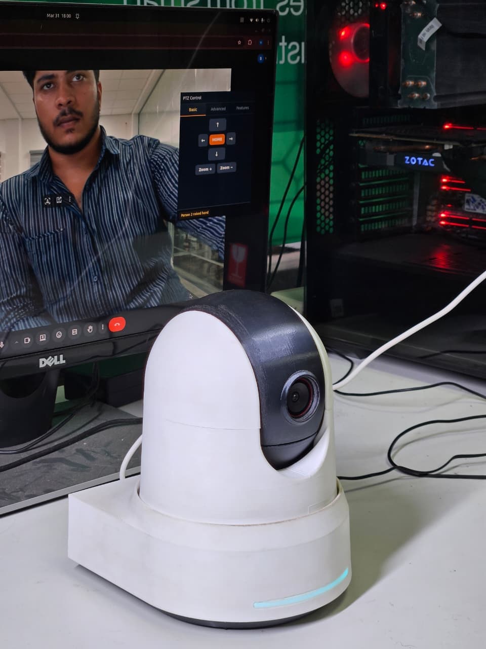 The PTZ camera prototype on the bench in front of its control software