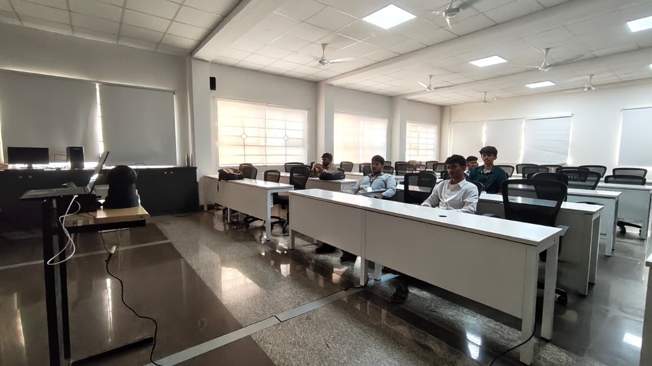 The PTZ camera deployed on a tripod in a lecture hall with students