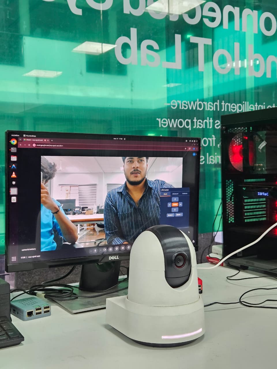 The mattrlabs bench — the PTZ camera prototype in front of its control software in the lab